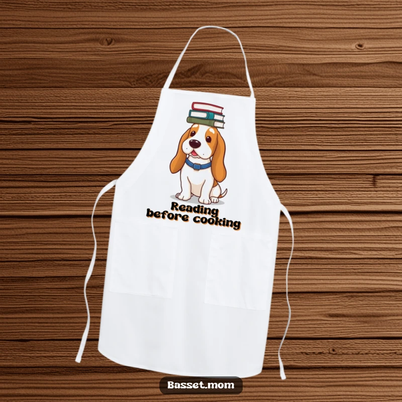 Funny Basset Hound apron, showing a dog balancing a stack of books on its head, ready to assist in the kitchen.