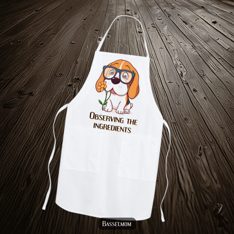 Funny Basset Hound apron with a dog wearing large glasses, curiously sniffing a flower, adding a touch of whimsy to cooking.