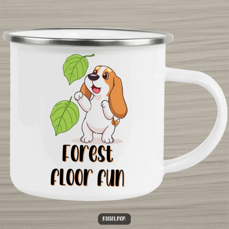 Funny Basset Hound camping mug, showing a dog playfully trying to catch a large leaf, a humorous and spirited outdoor companion.