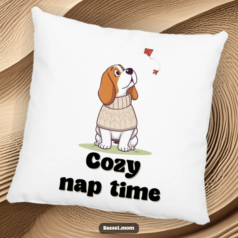 Funny Basset Hound pillow showcasing a dog in a knitted sweater looking up at a kite, adding cozy humor and whimsical charm.