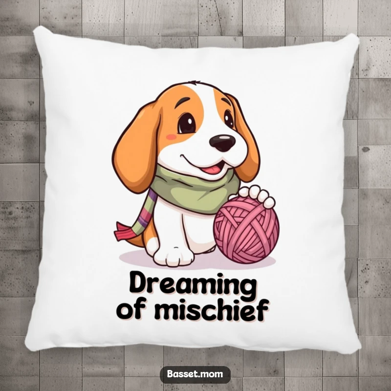 Funny Basset Hound pillow, a plush dog wearing a scarf, batting at a yarn ball with its paws, soft and inviting.