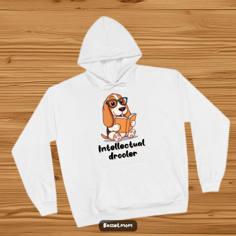 Funny Basset Hound hoodie, a dog wearing reading glasses deeply focused on a book, offering warmth and intellectual charm, a cozy gift.