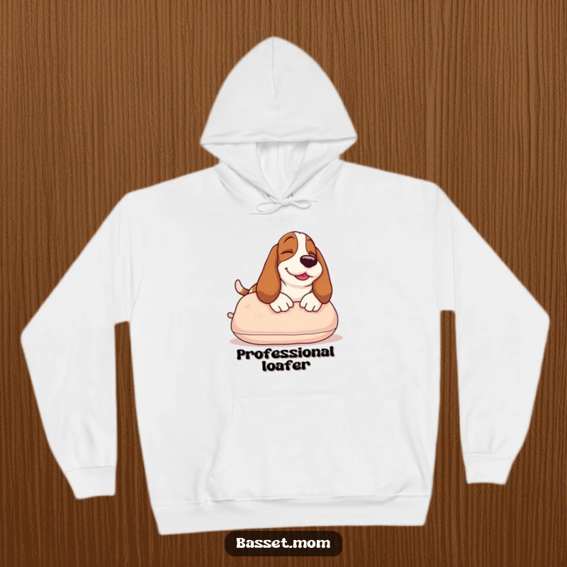 Funny Basset Hound hoodie depicting a happy dog sunbathing on a pillow, offering warmth and a splash of humorous comfort.