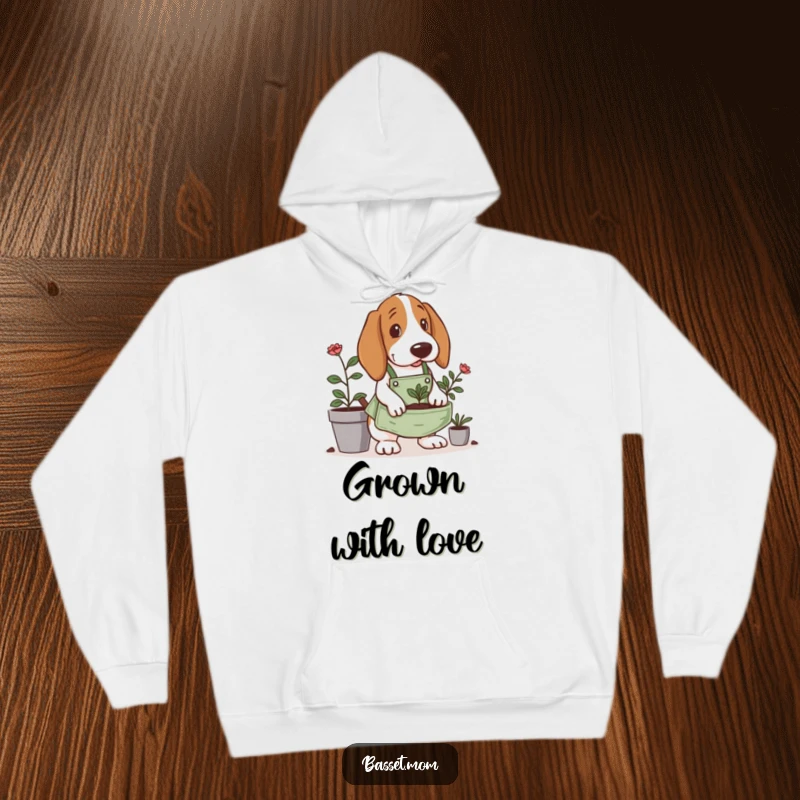 Funny Basset Hound hoodie, wearing a tiny gardening apron, digging in a planter, perfect for cozying up with a dose of garden humor.