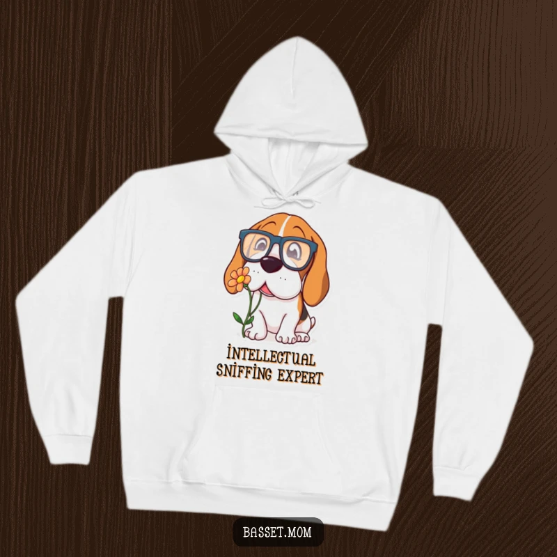 Funny Basset Hound hoodie of a dog wearing oversized spectacles, curiously sniffing a flower, offering warmth and intellectual charm.
