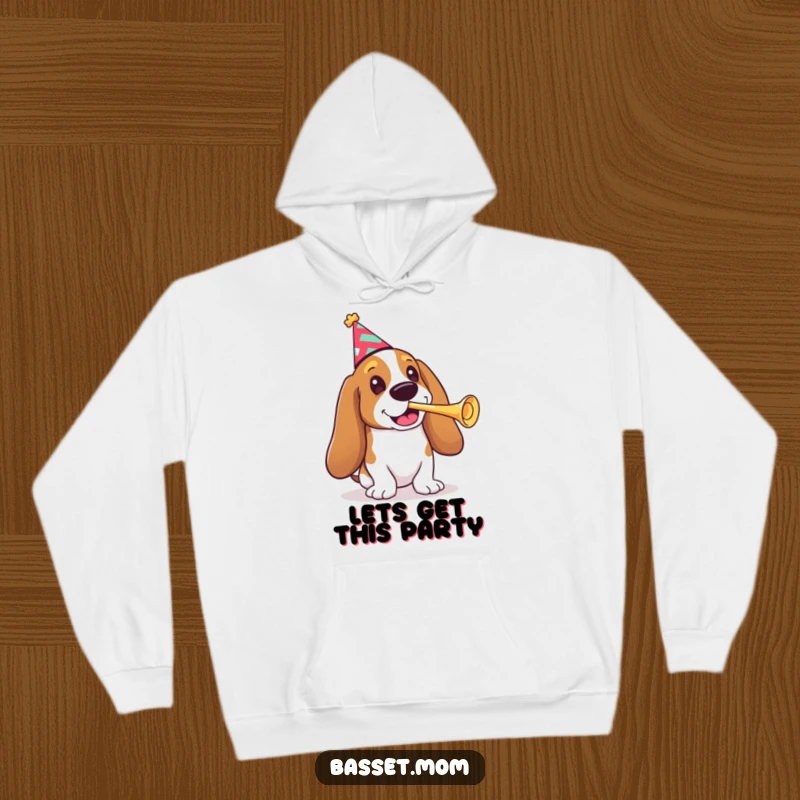 Funny Basset Hound hoodie, a dog wearing a festive party hat, playing a tiny trumpet with cheerful abandon.