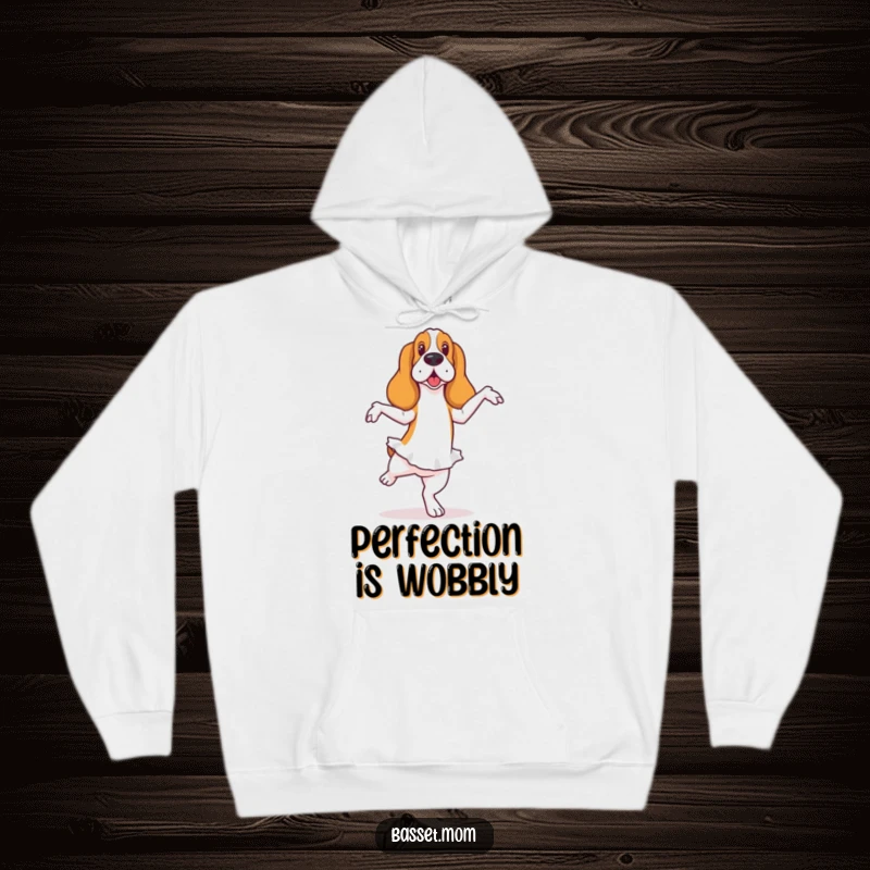 Funny Basset Hound hoodie depicting a dog in a ballet pose with a wobble, offering cozy humor and graceful charm.