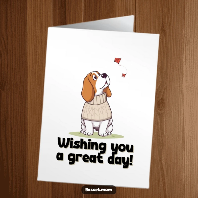 Funny Free Printable Birthday Card: A Basset Hound in a knitted sweater gazing upwards with wonder at a flying kite.