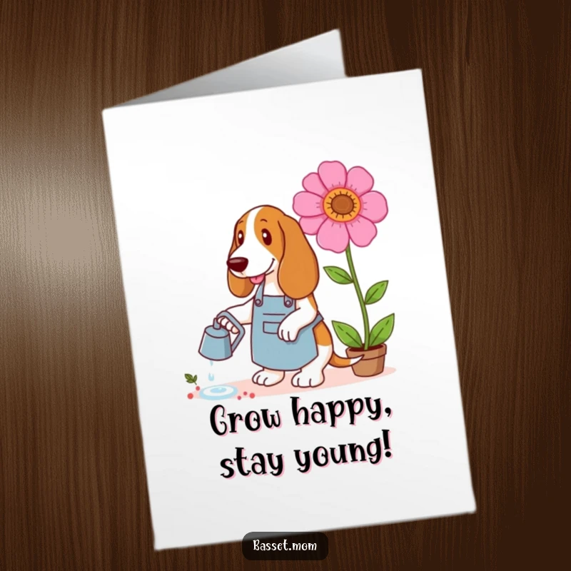 Funny Free Printable Birthday Card: A Basset Hound in an apron watering a comically giant, vibrant flower.