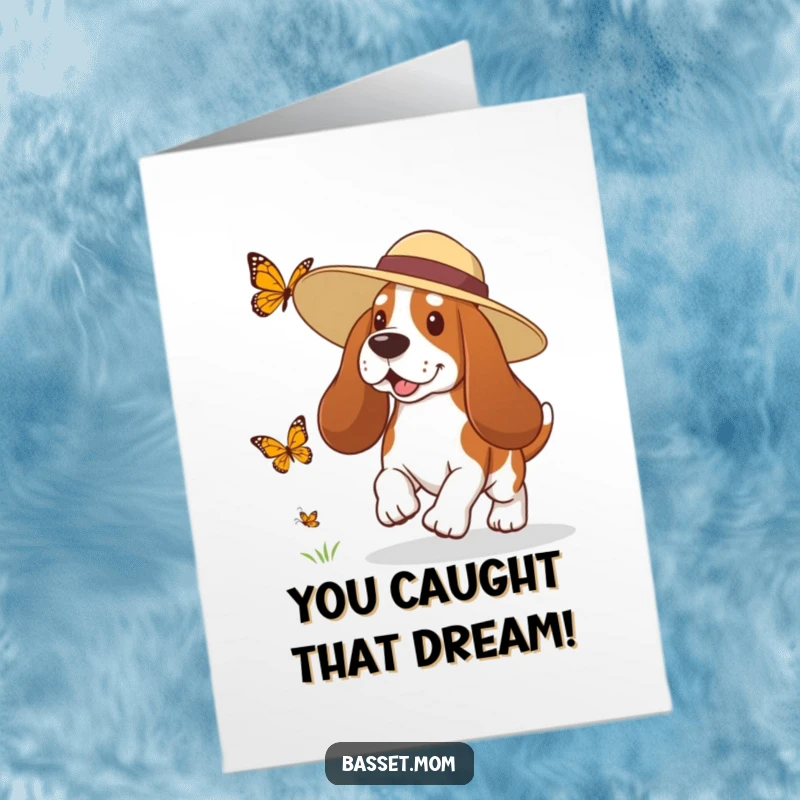 Funny Free Printable Congrats Card: A Basset Hound wearing a sun hat in playful pursuit of a fluttering butterfly.