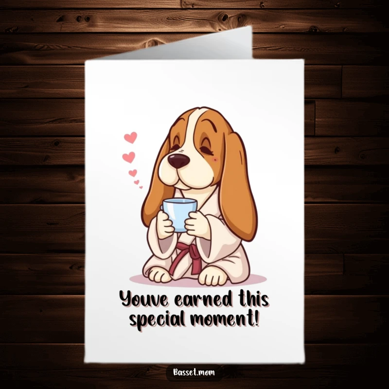 Funny free printable congratulations card showing a Basset Hound in a robe, enjoying tea with a peaceful, contented expression.