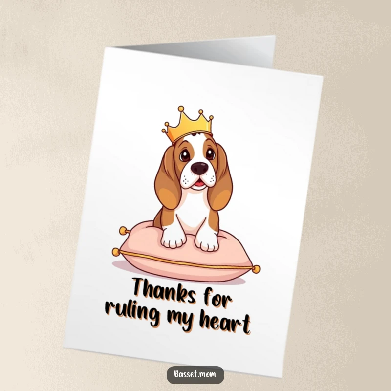 Funny free printable thank you card showing a Basset Hound, crowned and regal, surveying its domain from a comfortable cushion.