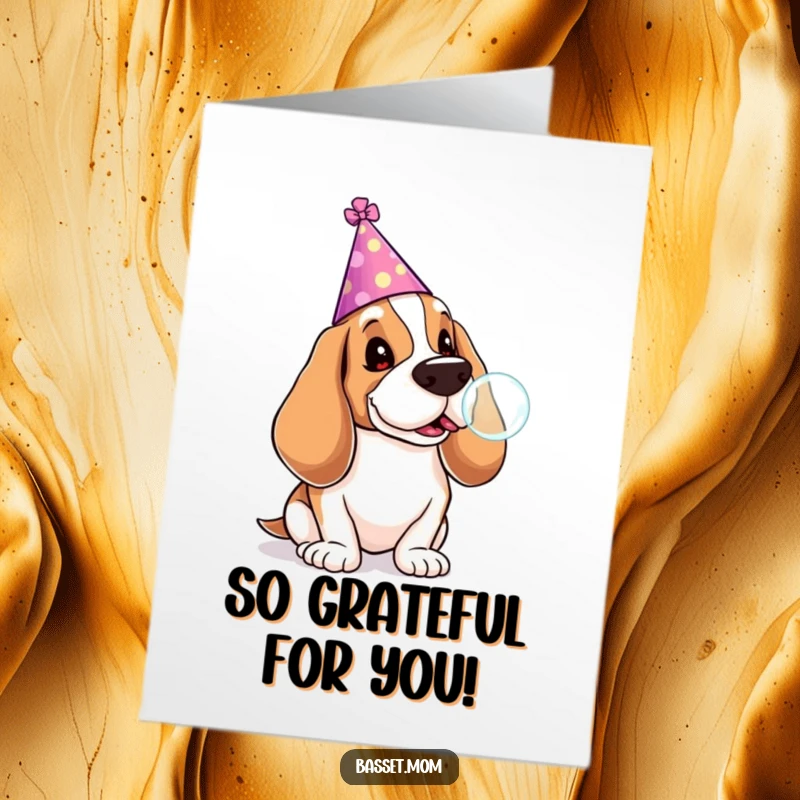 Funny Free Printable Thank You Card: A festive Basset Hound in a party hat blowing a lollipop bubble, conveying thanks joyfully.