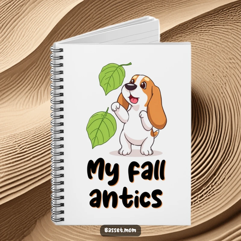 Funny Basset Hound notebook, cover art of a dog playfully chasing a big leaf, inspiring autumn creativity and notes.
