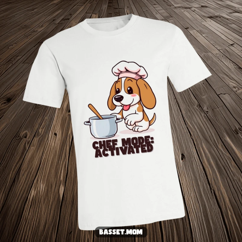 Funny Basset Hound t-shirt featuring a dog wearing a small chef hat, energetically stirring a pot with great enthusiasm.