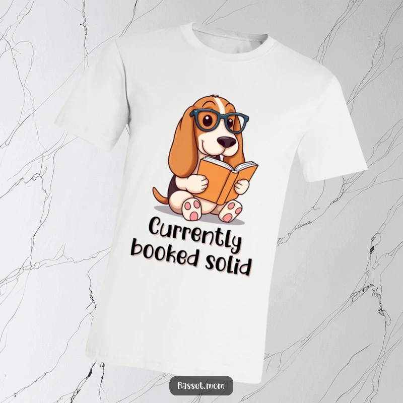 Funny Basset Hound t-shirt, a dog wearing glasses absorbed in a book, representing a love for reading, a humorous intellectual gift.