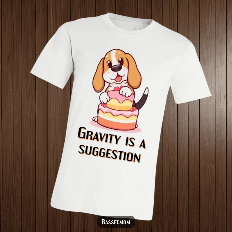 Funny Basset Hound t-shirt, depicting a clumsy dog with a wagging tail trying to balance a cake, a hilarious pet owner gift.