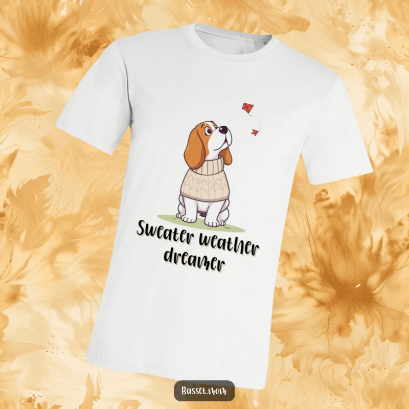Funny Basset Hound t-shirt featuring a dog in a knitted sweater looking up at a kite, expressing cozy curiosity and outdoor enjoyment.