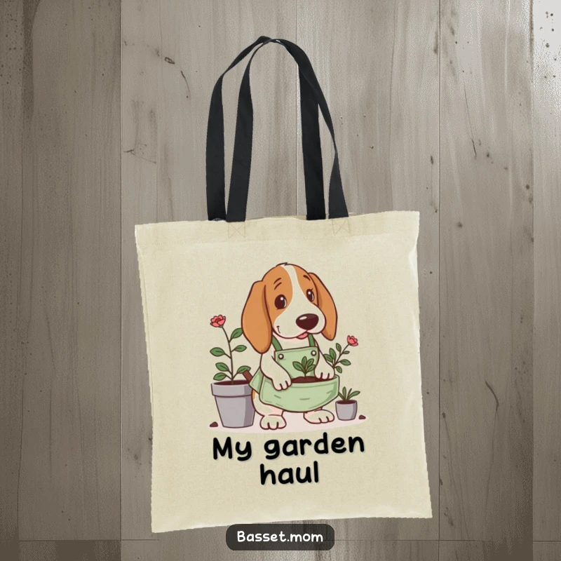 Funny Basset Hound tote bag, wearing a tiny gardening apron, digging in a planter, a stylish accessory for garden lovers.