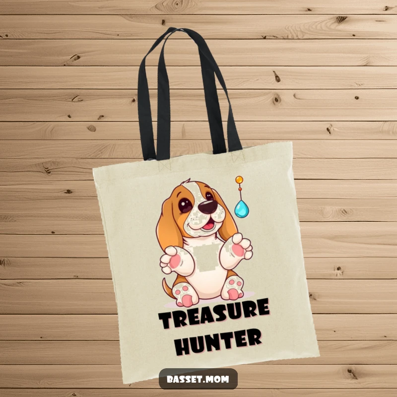 Funny Basset Hound tote bag showing a dog with paws raised, playfully swatting at a dangling shiny jewel, full of playful intent.